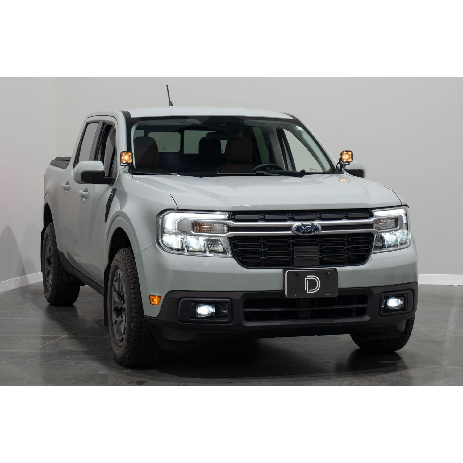 Adds SAE-compliant fog lights to the 2022+ Ford Maverick.