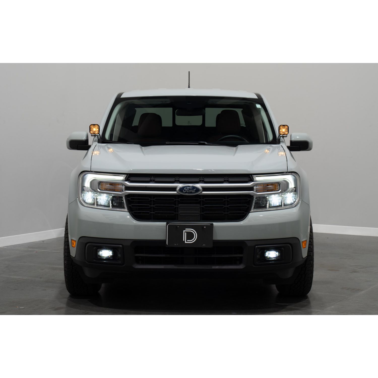 Adds SAE-compliant fog lights to the 2022+ Ford Maverick.